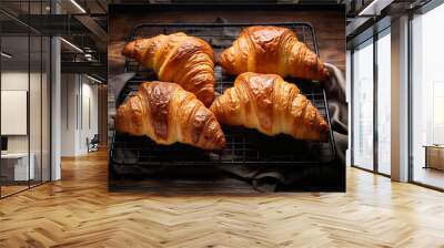 Freshly Baked Croissants on Cooling Rack with Dark Background Wall mural