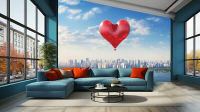 red balloon in the shape of a heart, over the city on a blue sky Wall mural