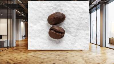 Two roasted coffee beans in inverted positions in macro photography. Top view Wall mural