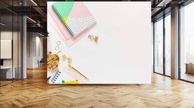 Flat lay desk table. Workspace with modern notebooks, stationery, succulents and jewelry on white table. Top view, copy space. Wall mural