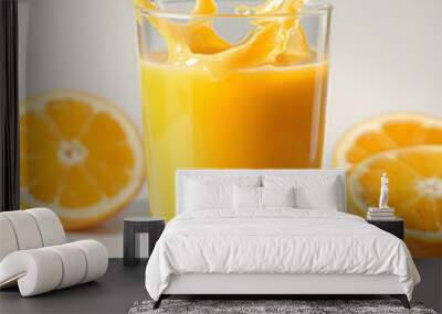 orange juice in a glass. Splashes. Summer drink. tropical juice. Refreshing drink. Wall mural