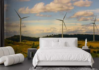 energy saving concept with wind turbine construction in field and meadow with beauty blue sky and cloudy background Wall mural