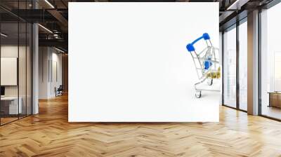 web banner business and finance saving activity with  gold coin arrange in cart with white isolated background Wall mural