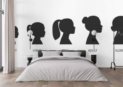 The stages of a woman's growing up - infant, child, teen, adult, elderly. Collection of silhouettes of women of different ages. Vector illustration isolated on white background Wall mural