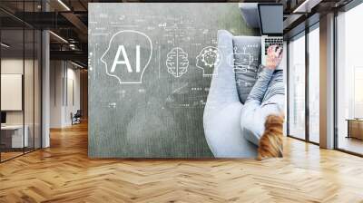 AI concept with man using a laptop in a modern gray chair Wall mural