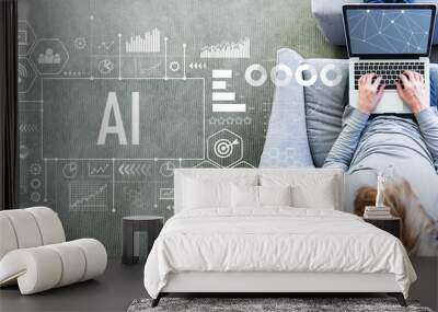 ai with man using a laptop in a modern gray chair Wall mural