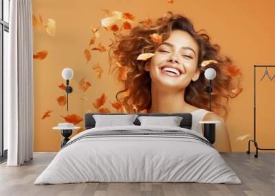 Beautiful young hispanic woman with autumn leaves Wall mural