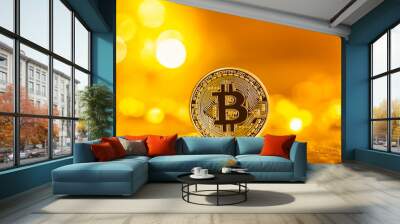 Bitcoin cryptocurrency coin on a bright gold background Wall mural