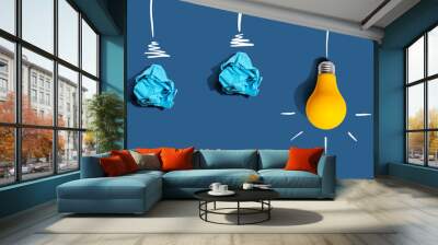 Brainstorming concept with crumpled paper light bulbs - Flat lay Wall mural