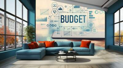 Budget with man holding a tablet computer Wall mural