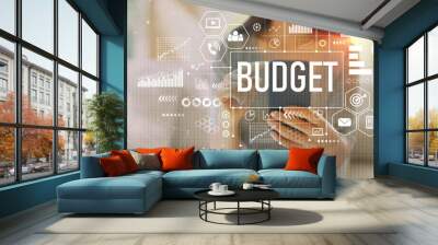 Budget with woman using her smartphone on a couch Wall mural