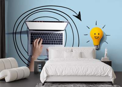 Creativity, inspiration, idea concept with light bulb and laptop computer- Flat lay Wall mural