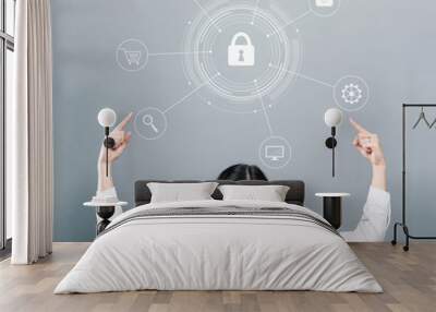 Cyber security with business woman pointing upwards on a gray background Wall mural