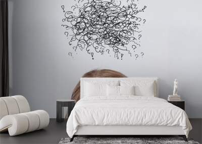 Doodles with young woman looking upwards on a gray background Wall mural