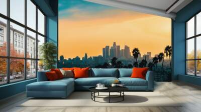 Downtown Los Angeles skyline at sunset with palm trees in the foreground Wall mural