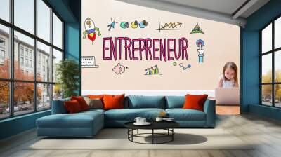 Entrepreneur text with little girl using a laptop computer on floor Wall mural