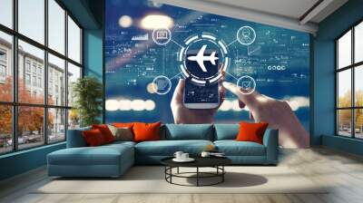 Flight ticket booking concept with person using smartphone Wall mural