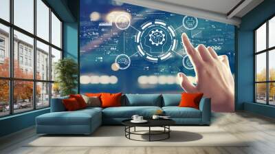 Future technology concept with hand pressing a button on a technology screen Wall mural