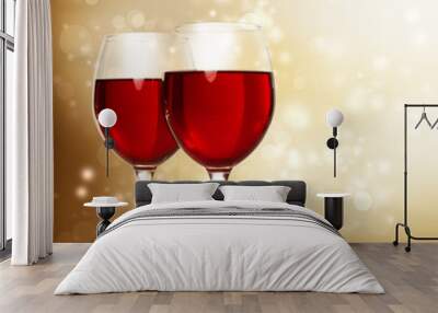 glasses of red wine on sparkling golden background Wall mural