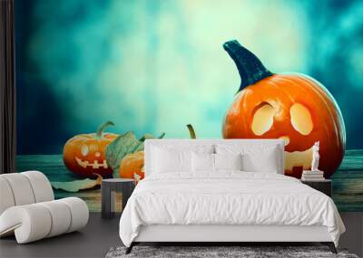 Halloween pumpkins on a spooky forest at night Wall mural