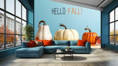 Hello fall message with pumpkins on a blue background Wall mural