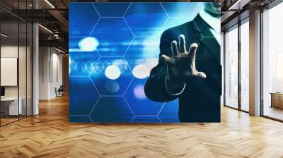 Hexagon Grid with businessman on blurred blue light background Wall mural