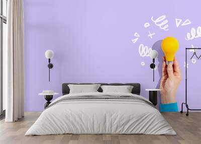 Idea light bulb with hand drawing sketch - Flat lay Wall mural