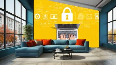 Internet network security concept with person using a laptop computer Wall mural