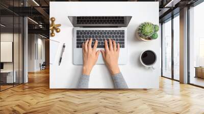 Laptop workstation with office supplies from above Wall mural