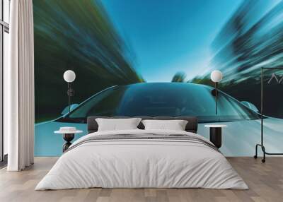 Luxury vehicle driving down the road with motion blur Wall mural