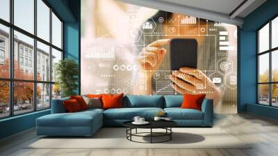 Marketing concept with woman using her smartphone in a living room Wall mural