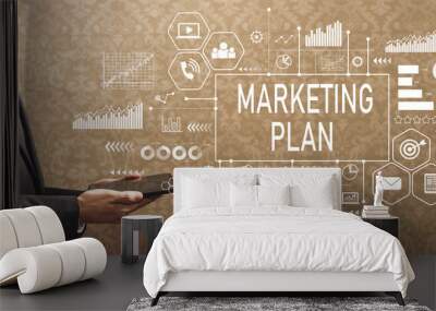 Marketing plan with businessman holding a tablet computer on a dark vintage background Wall mural