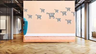 Online shopping with young woman using her laptop in a chair Wall mural