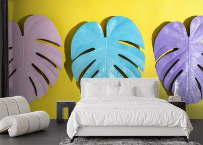 Painted tropical monstera leaves with hard shadow on a yellow background Wall mural