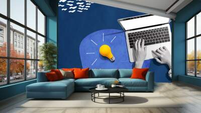 Person using a laptop computer and light bulbs - Collage Wall mural