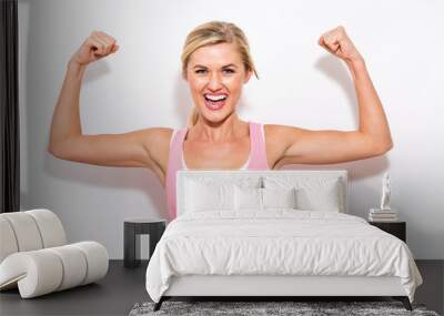 Powerful young fit woman on a white background Wall mural