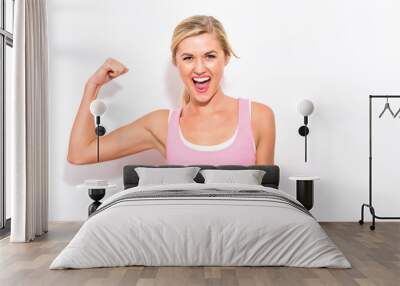 Powerful young fit woman on a white background Wall mural