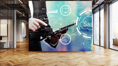 SaaS - software as a service concept with businessman using his tablet computer Wall mural