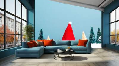 Santa hat and Christmas tree holiday theme Wall mural