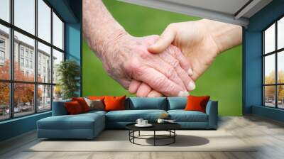 Senior and Young Women Holding Hands Wall mural