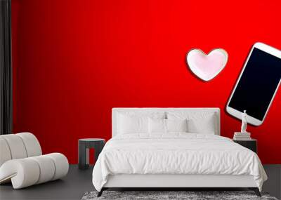 Smartphone with heart shaped dish - flat lay Wall mural