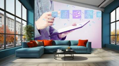 Stock trading concept with man holding a tablet computer Wall mural