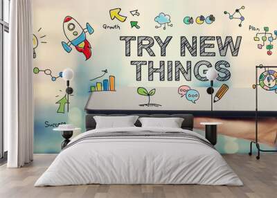 Try New Things concept with man holding a tablet Wall mural