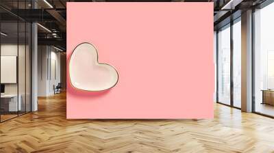 Two pink heart dishes on a pastel pink background Wall mural