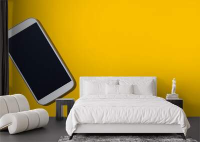 White smartphone with black screen from above - flat lay Wall mural