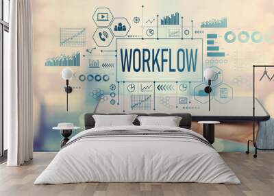 Workflow with man holding a tablet computer Wall mural