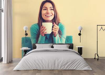 Young latina woman drinking coffee Wall mural