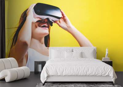 Young woman using virtual reality headset Wall mural