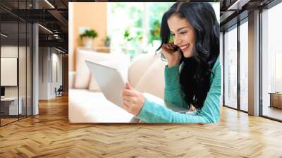 Young woman with a laptop computer in a bright interior room Wall mural