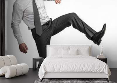 caucasian businessman in kicking position. Wall mural